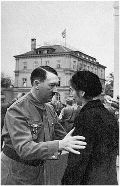 Adolf Hitler speaks to the widow of a Nazi party member who died during the 1923 Beer Hall Putsch